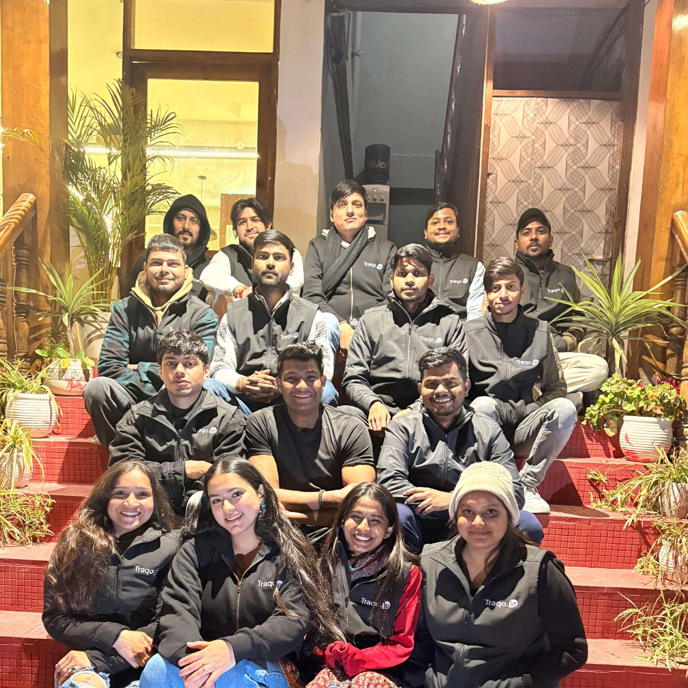 Team on the steps at the Bir Billing offsite